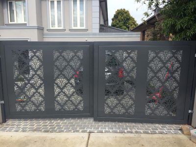 Decorative laser-cut aluminium sliding gate installed at a modern Melbourne home