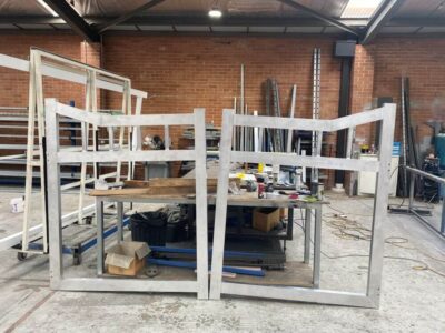 Raw aluminium gate frames during the fabrication and welding process in the workshop before powdercoating.
