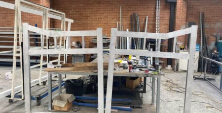 Raw aluminium gate frames during the fabrication and welding process in the workshop before powdercoating.
