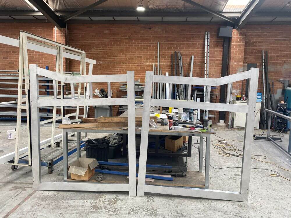 Raw aluminium gate frames during the fabrication and welding process in the workshop before powdercoating.